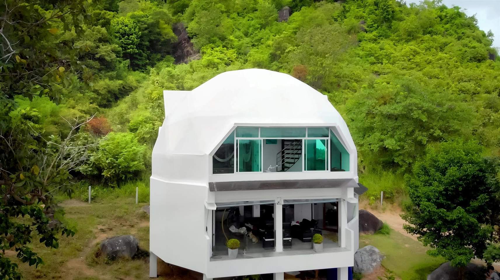 Dreamdome, a white geodesic house surrounded by tropical greenery on Koh Phangan